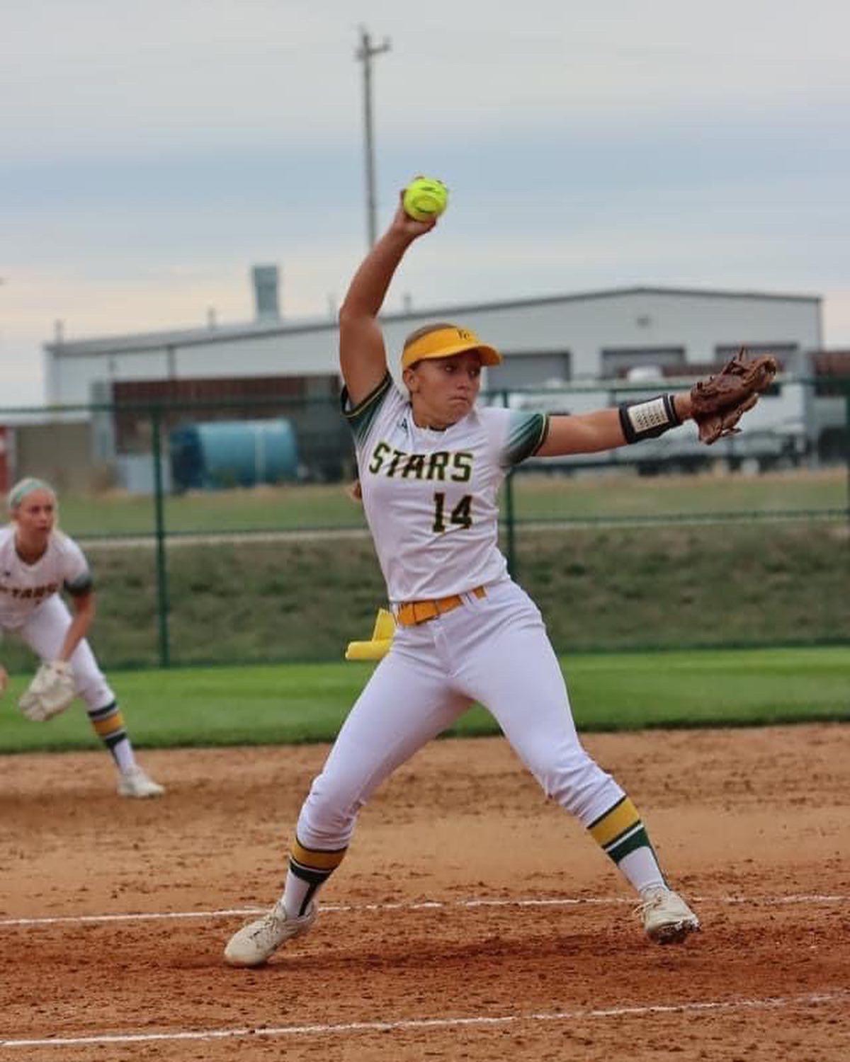 Stars pitcher #14 delivering a pitch during a game