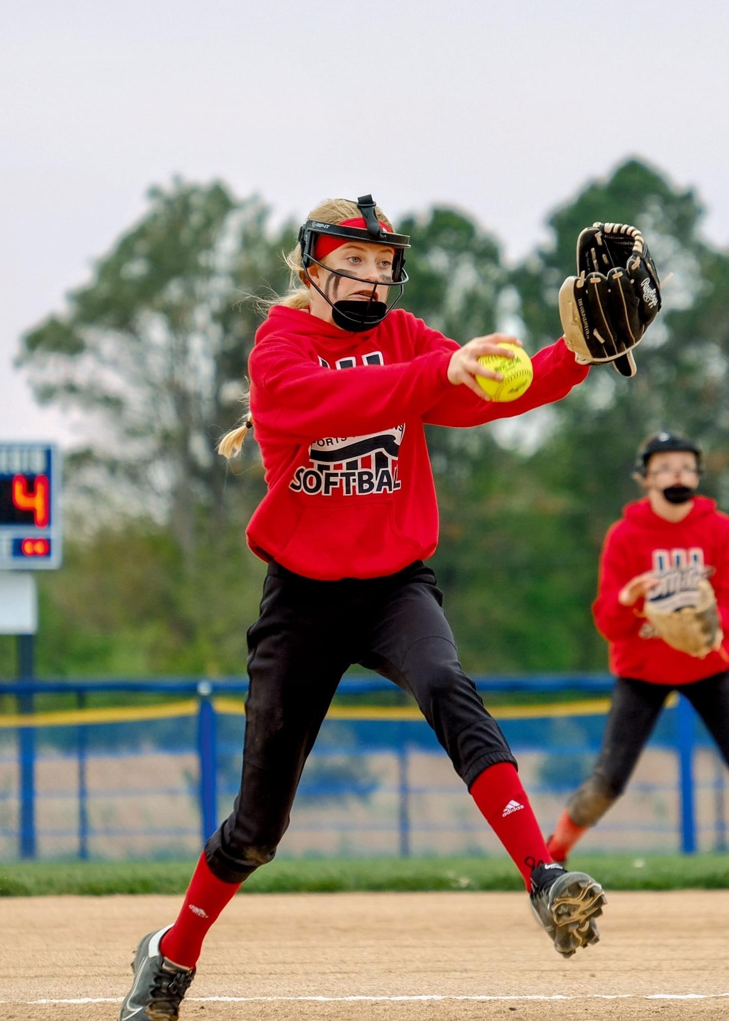 Pitcher delivering a pitch during a game