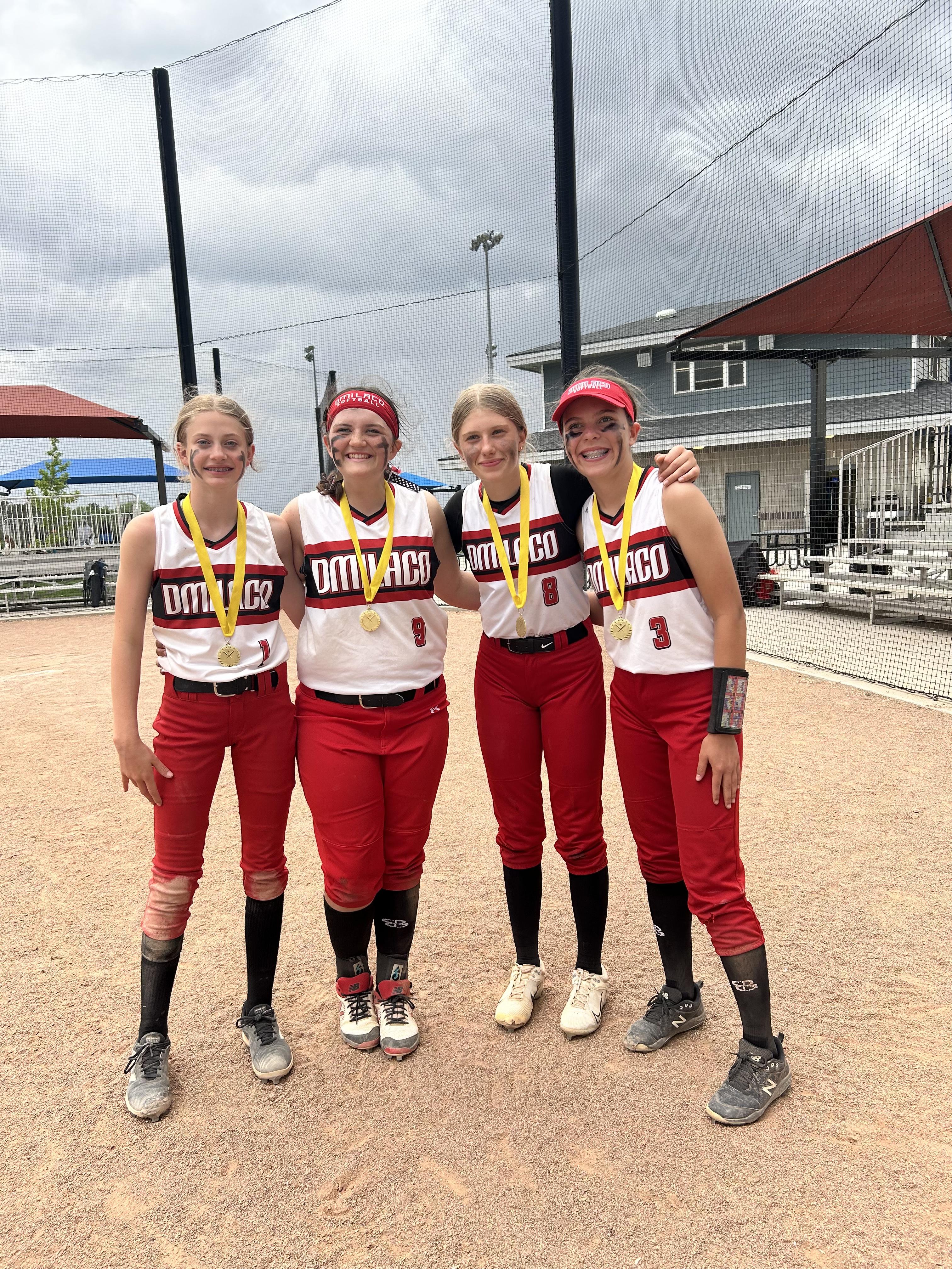 Dinlaco Softball teammates wearing medals after a tournament